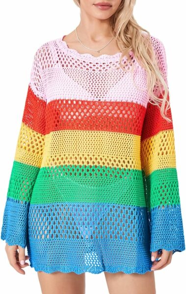 a woman wearing a rainbow sweater